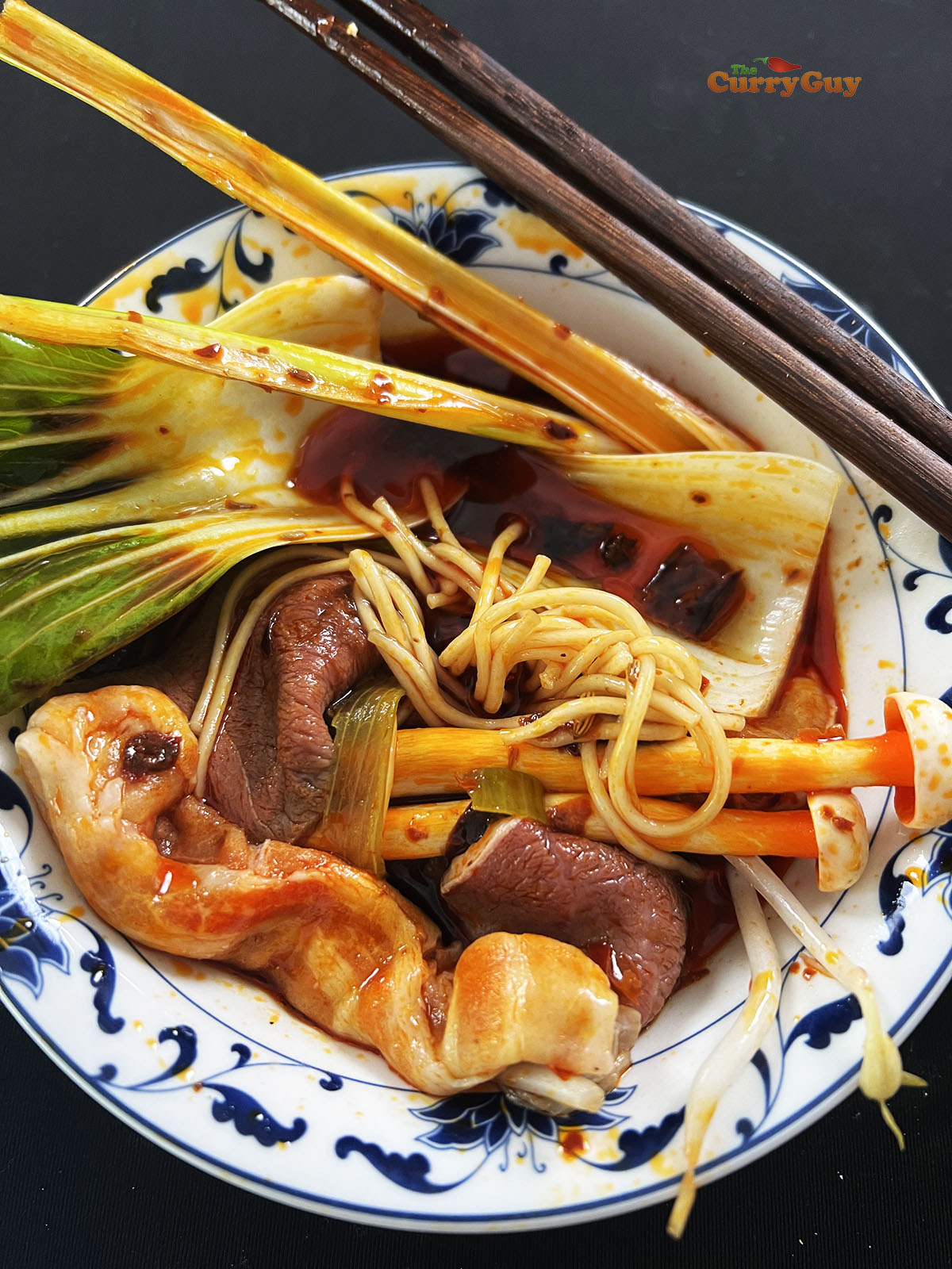 Vegetables and meat cooked in a hot pot broth