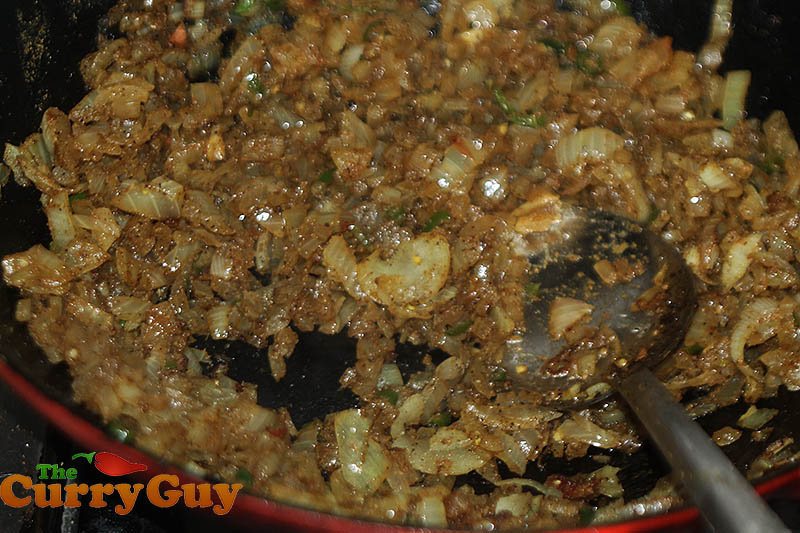 Frying onions for the curry sauce.