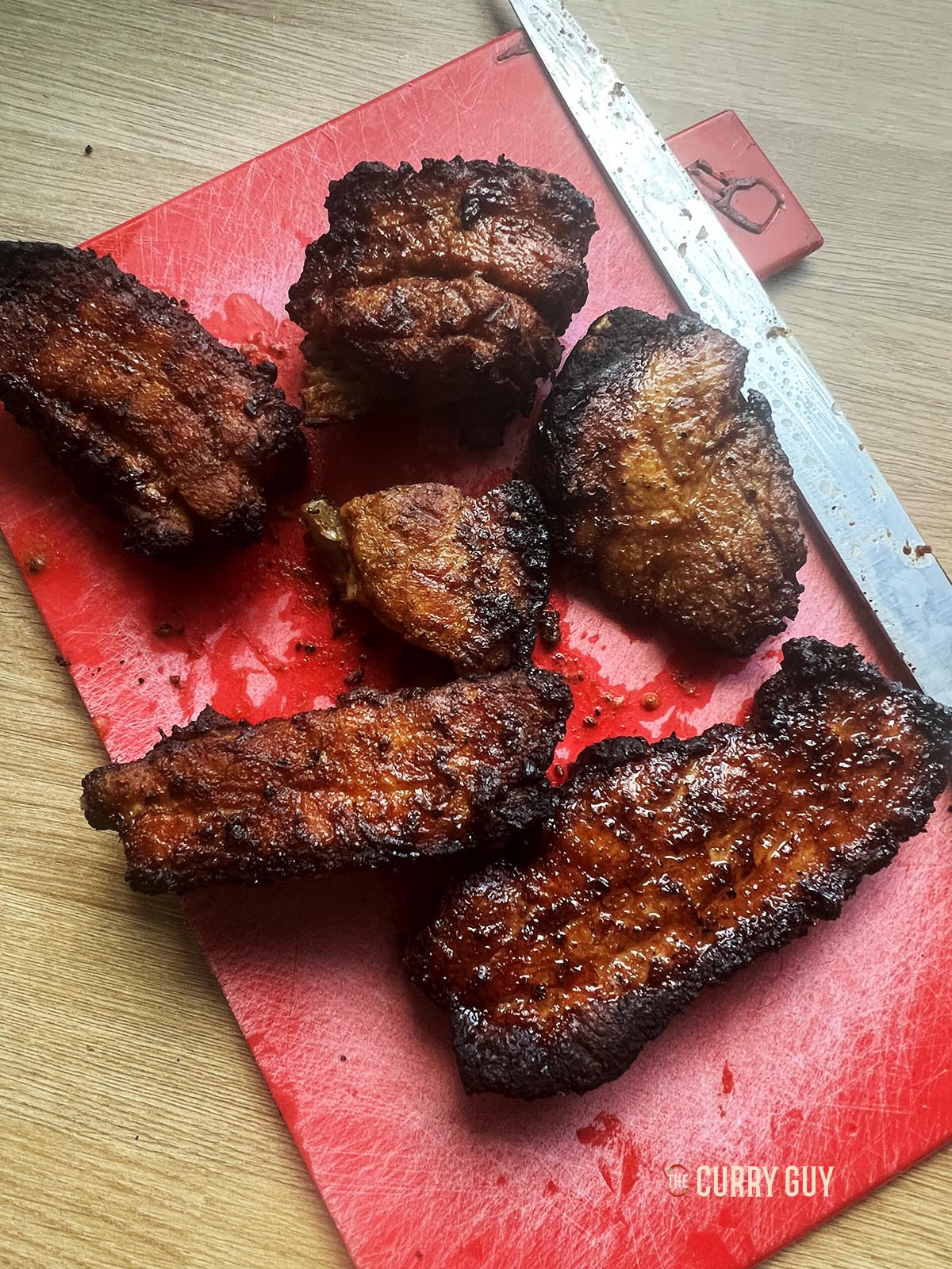 Roasted pork belly resting before slicing. 