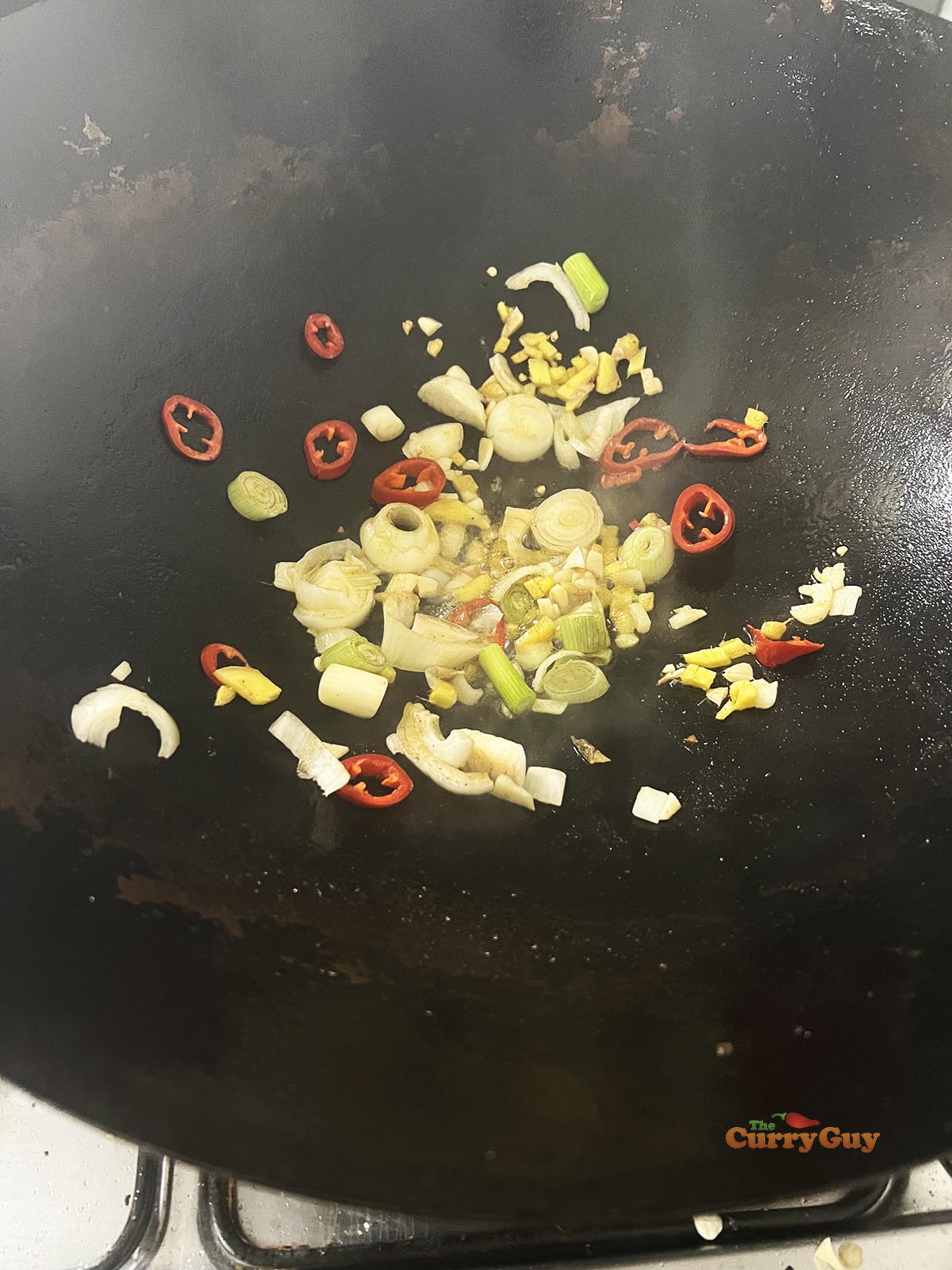 Frying the aromatic ingredients.