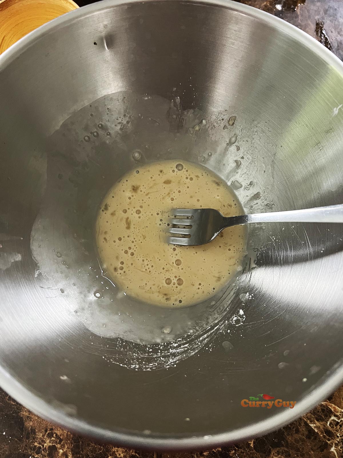 Whisking the marinade ingredients.