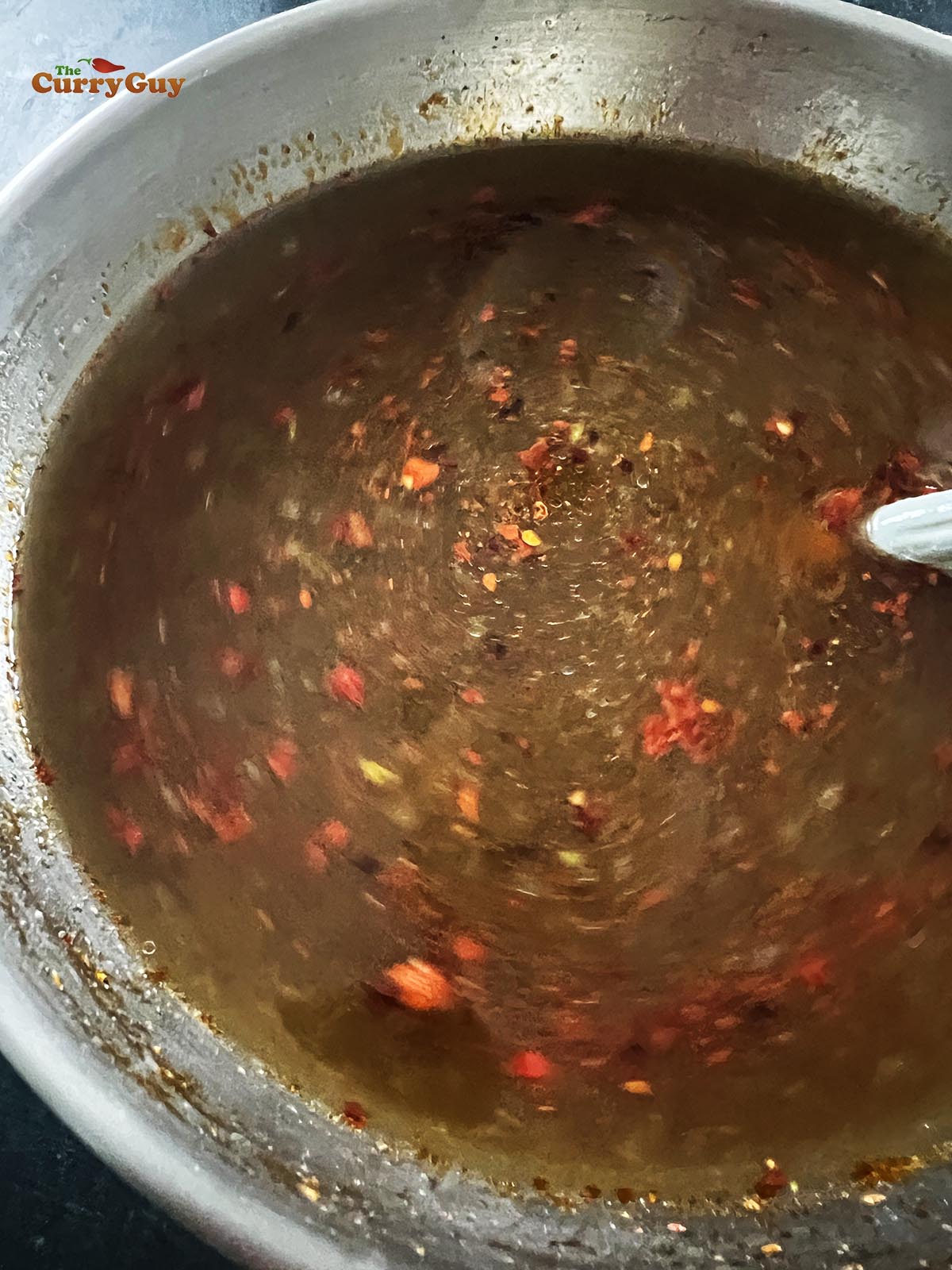 Stirring the sauce ingredients together. 