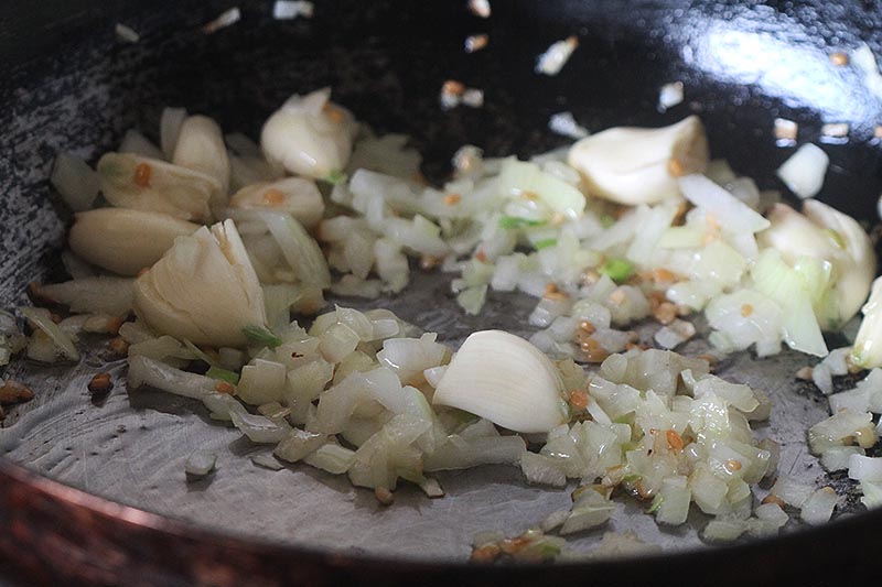 Adding garlic to the pan
