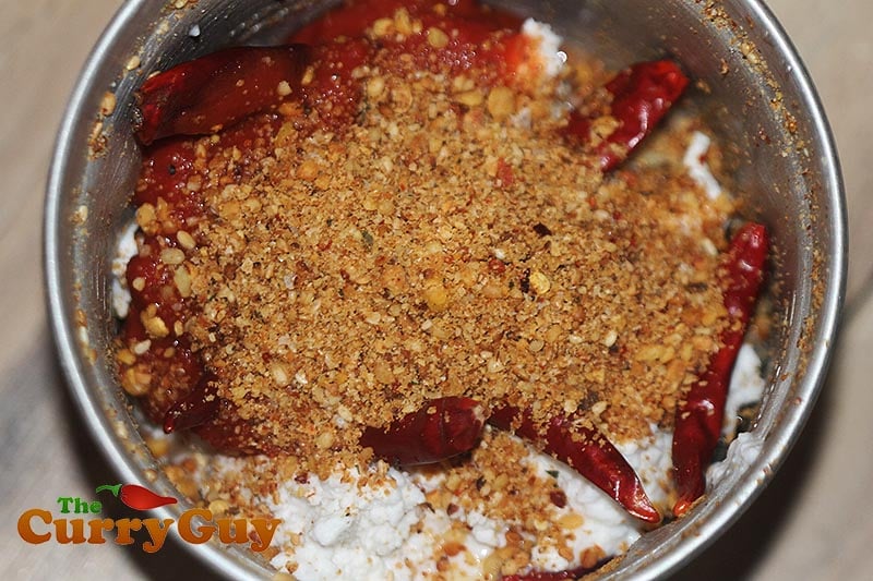 Making Coconut, tomato and chilli chutney