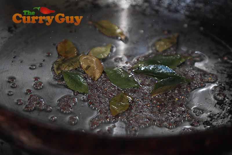 Making Coconut, tomato and chilli chutney