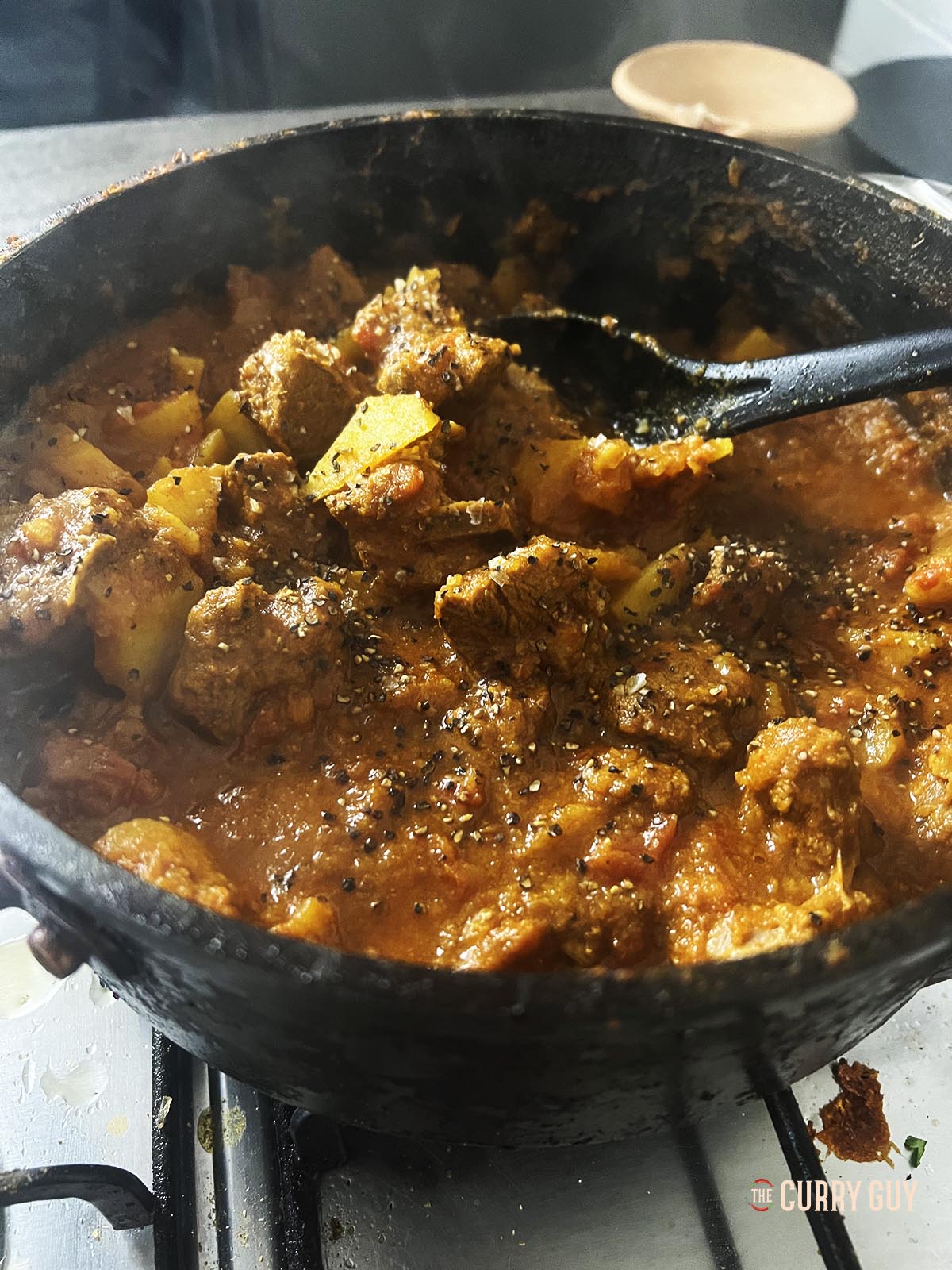 Simmering the sauce down to thicken.