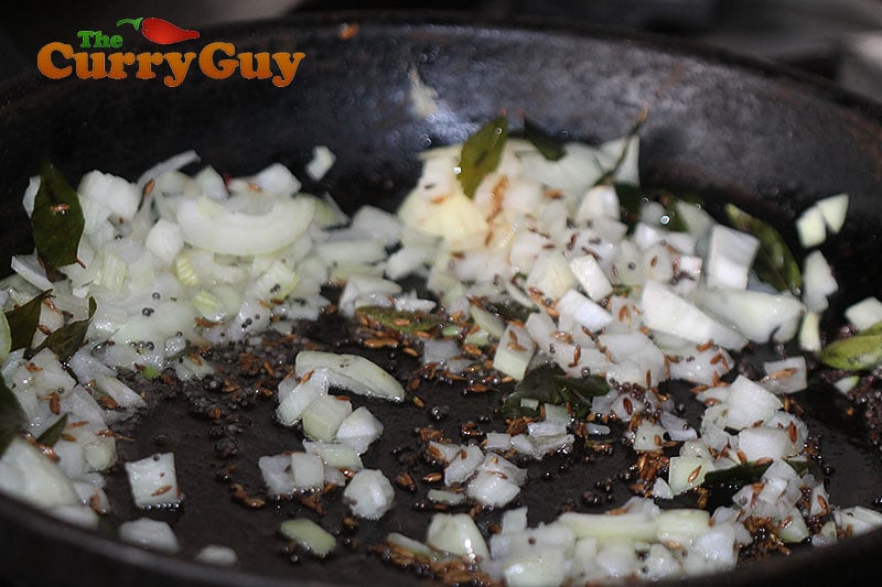 Making stir fried cauliflower