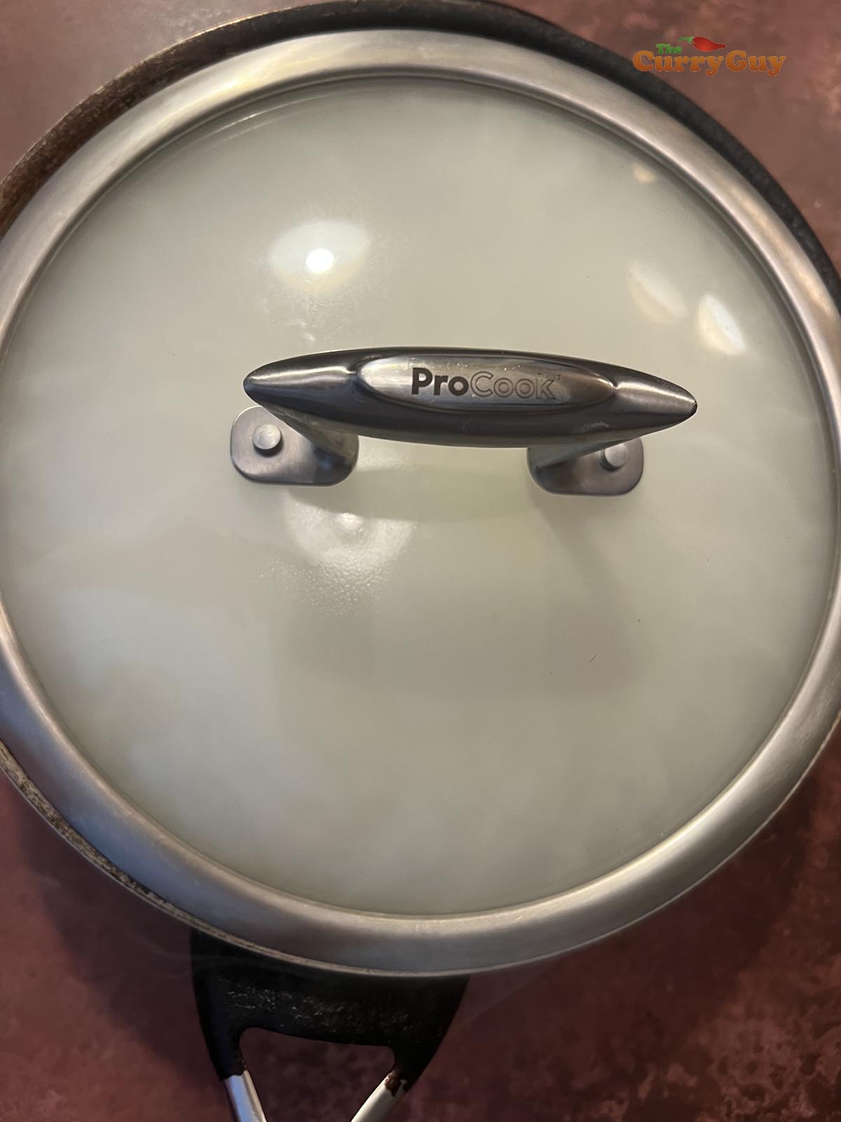 Chicken smoking in the pan