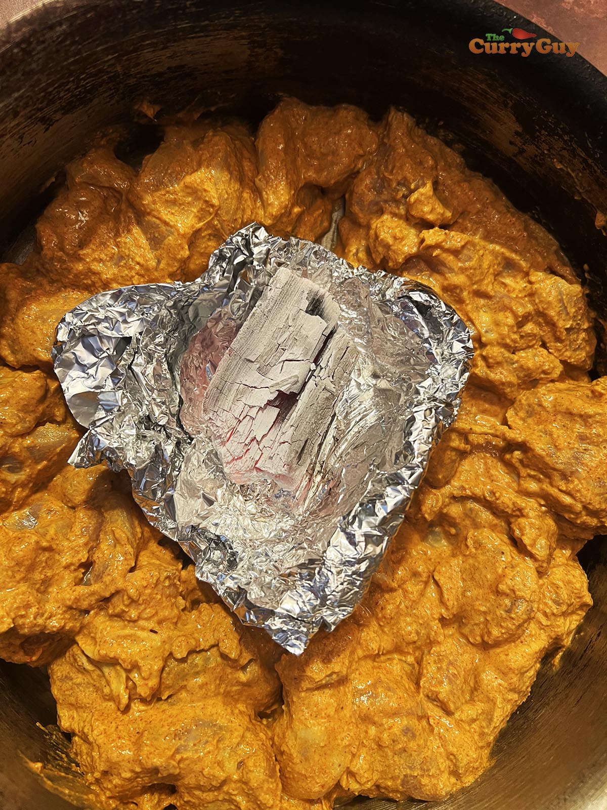 Charcoal burning in the chicken tikka