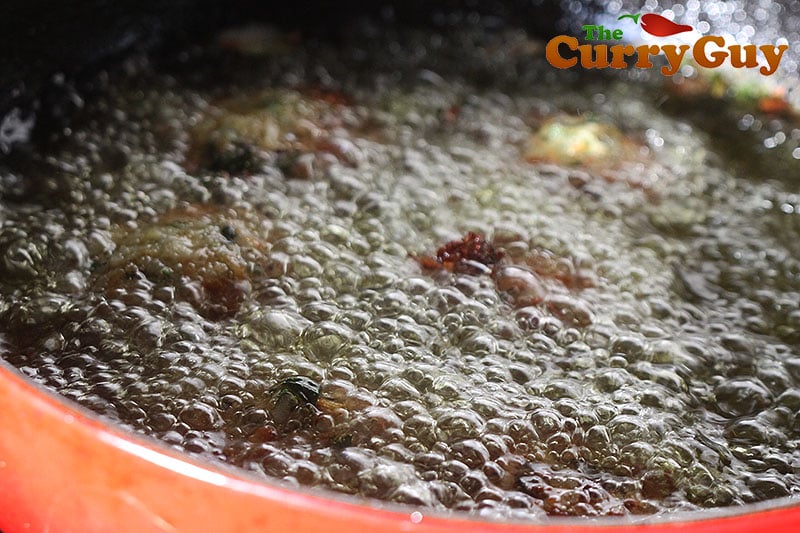 frying the koftas until crispy