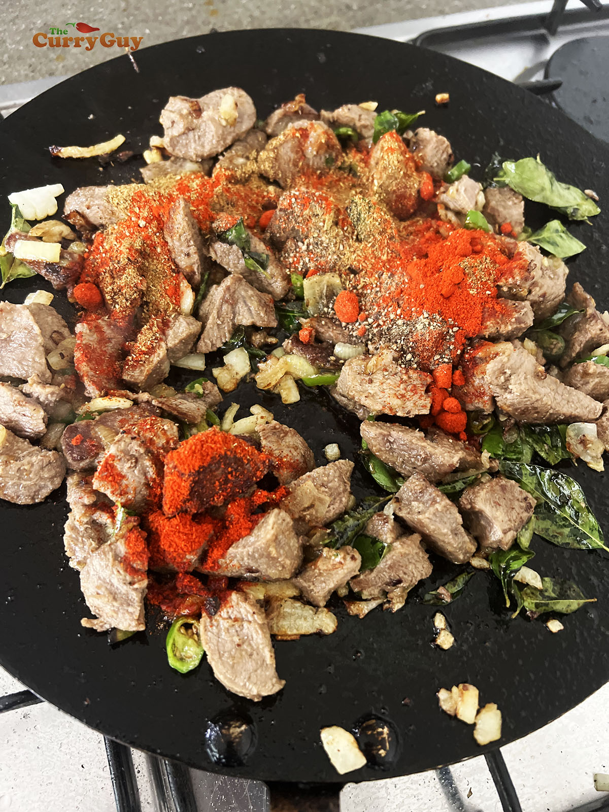 Adding ground spices.