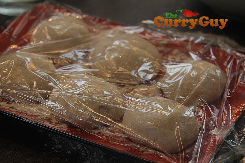 Making tandoor naans.