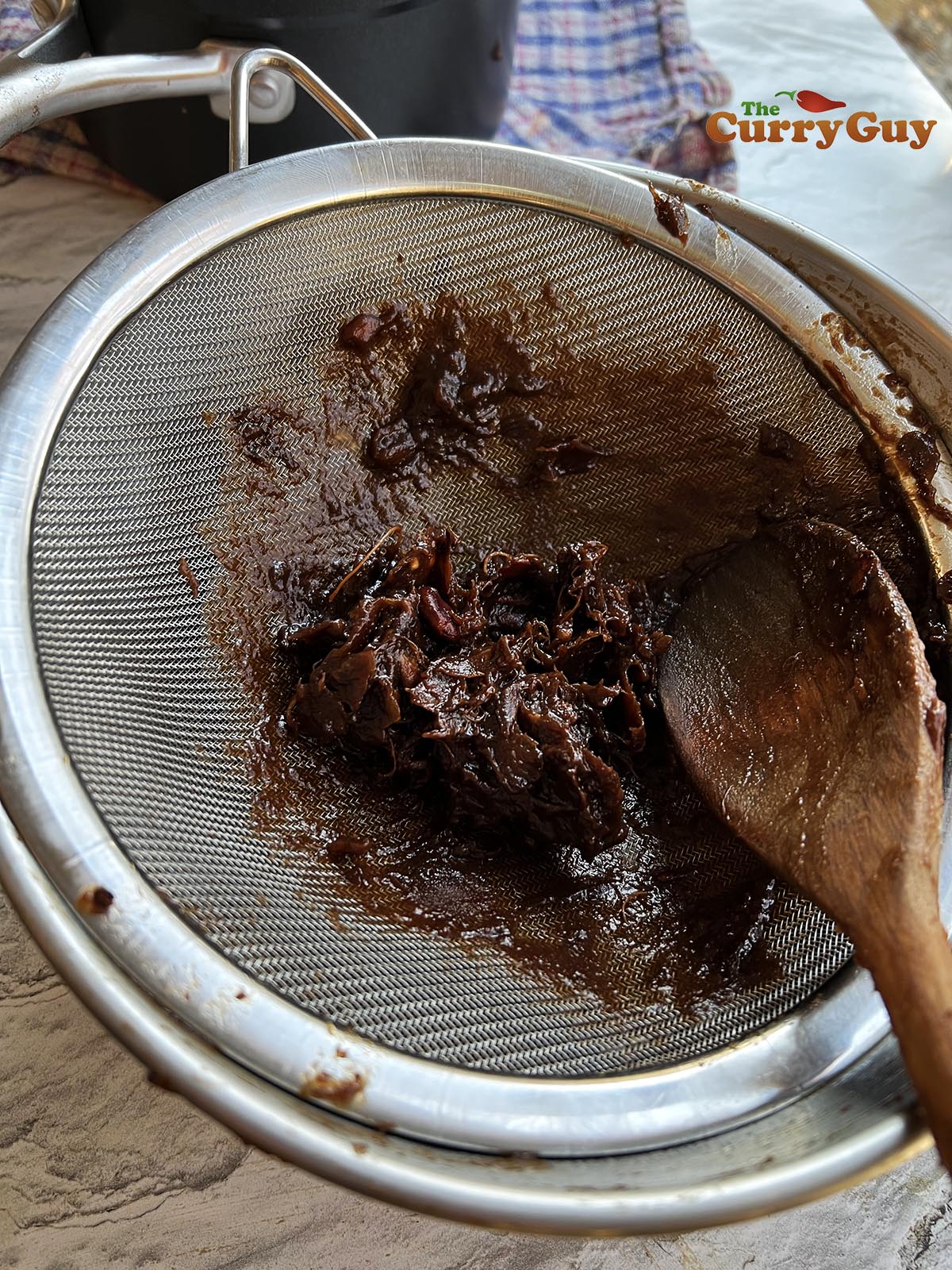 Tamarind bits in sieve.