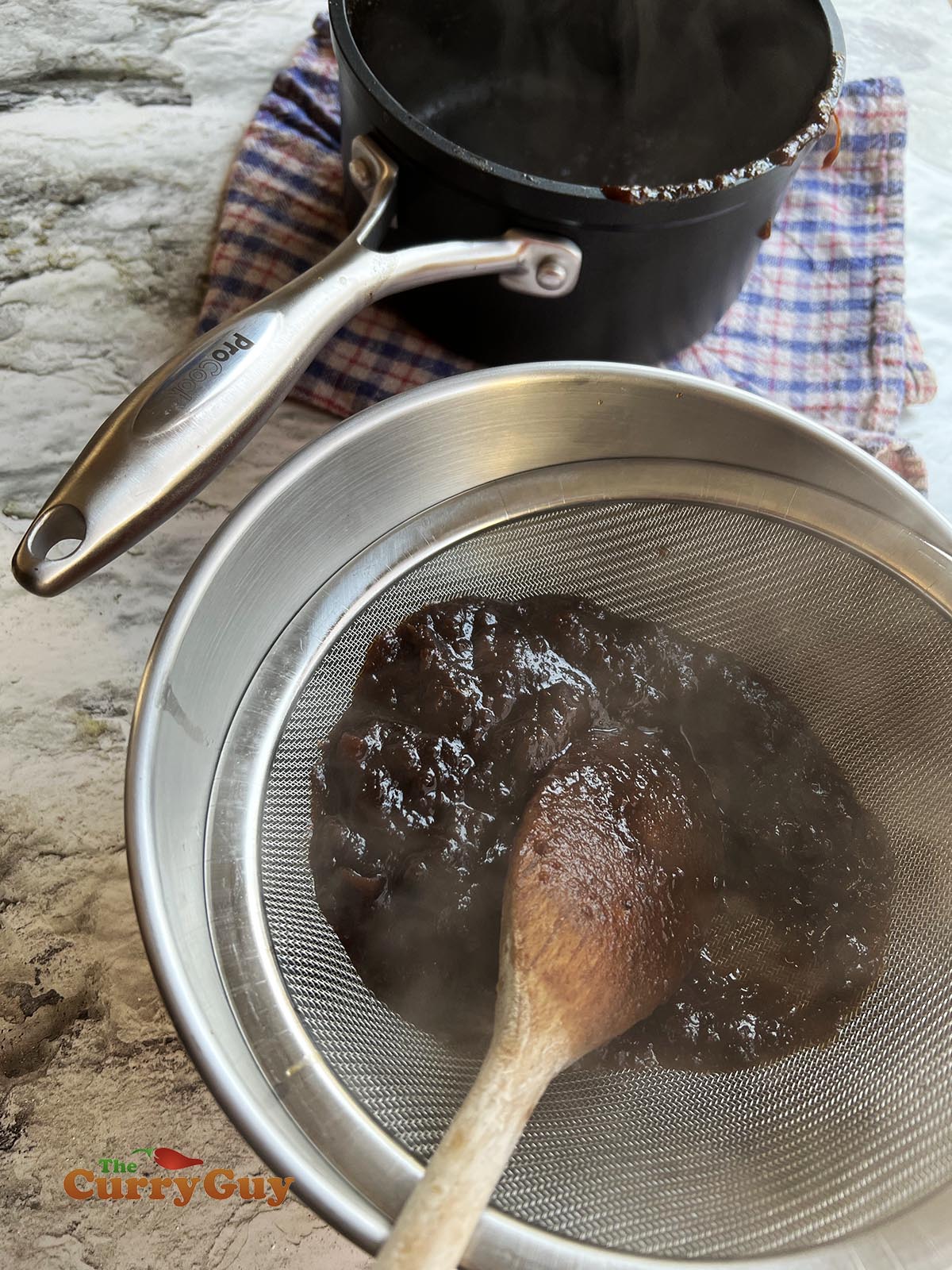 Running tamarind through a sieve