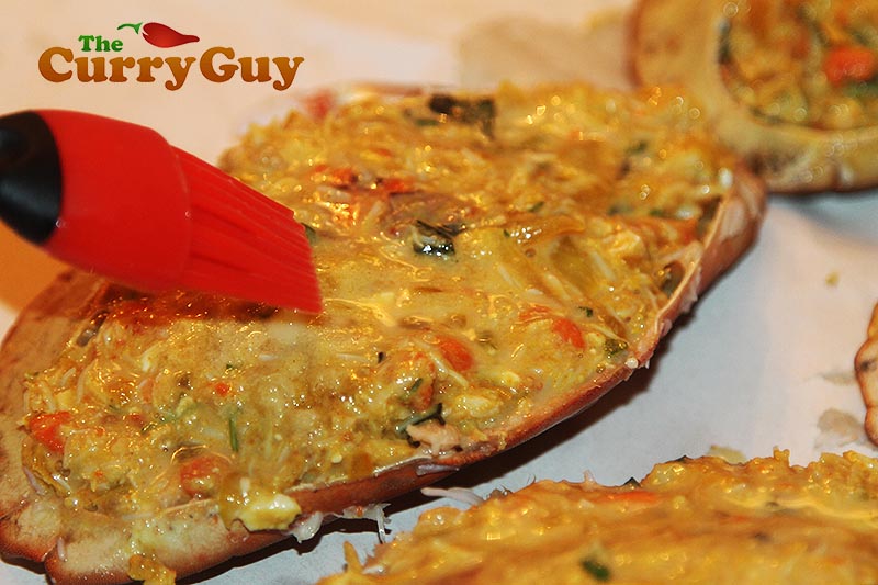 Making Masala stuffed crabs