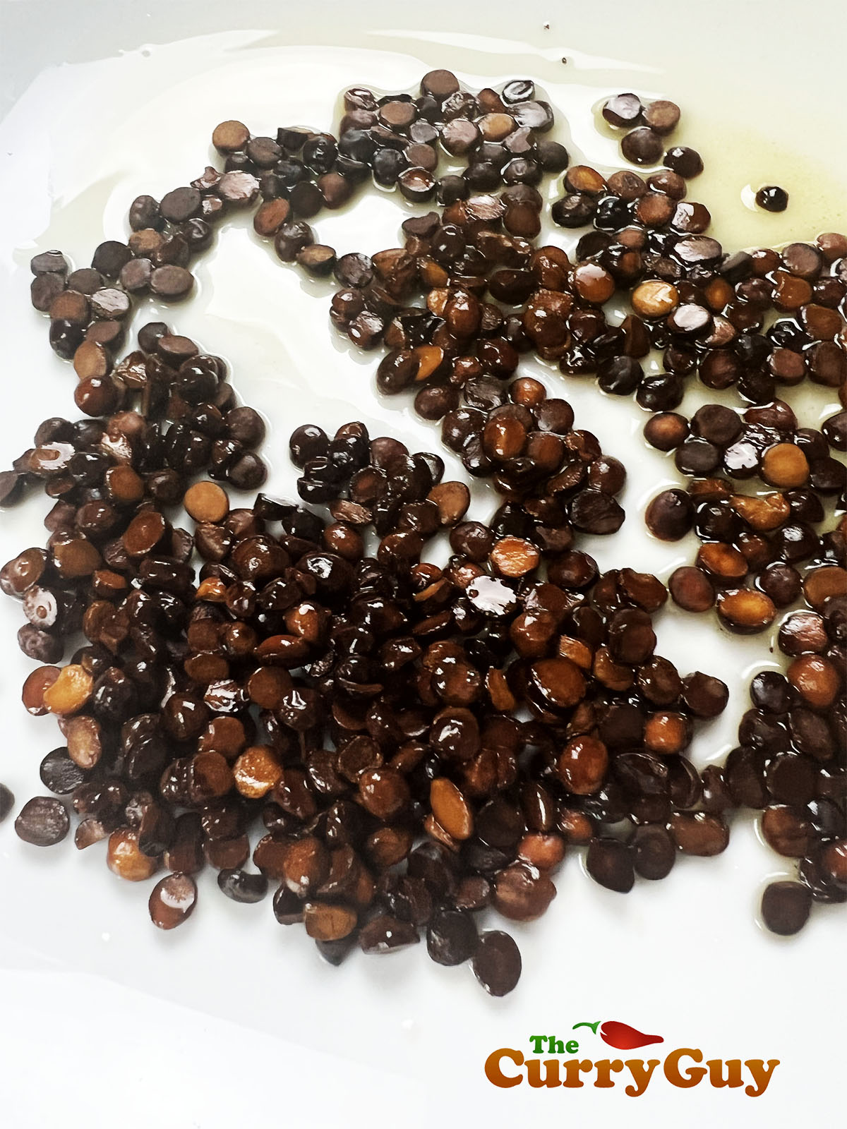 The dark brown chana lentils.