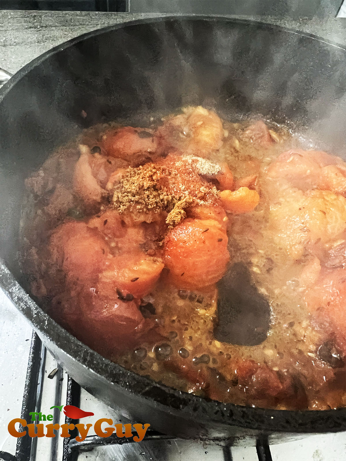 Adding the tomatoes and remaining ingredients.