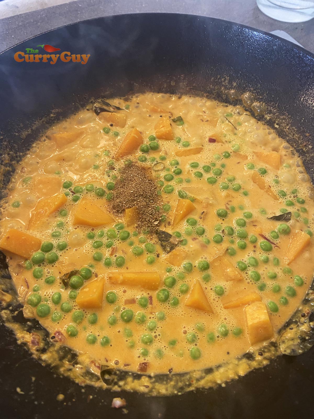 Adding peas to butternut squash curry