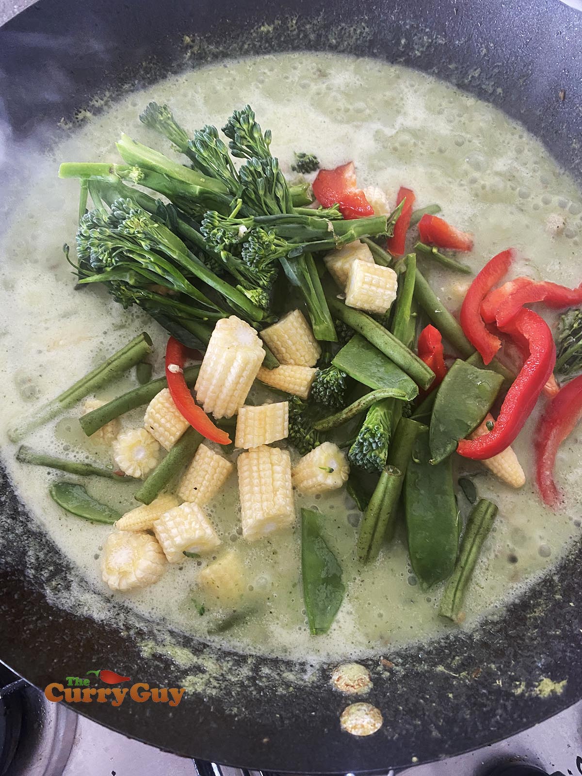 Adding vegetables to Thai Green Curry