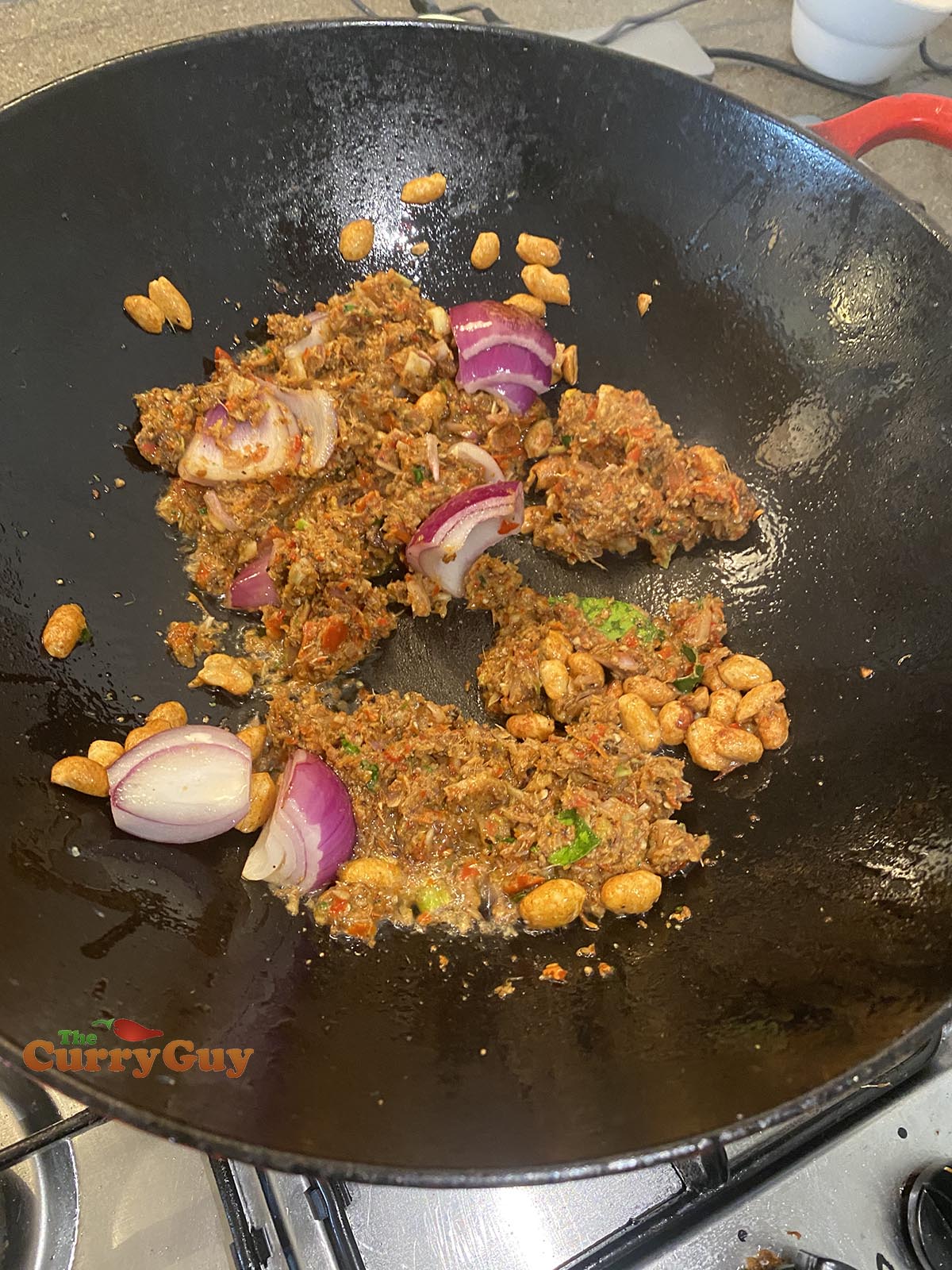 Adding Massaman paste to pan