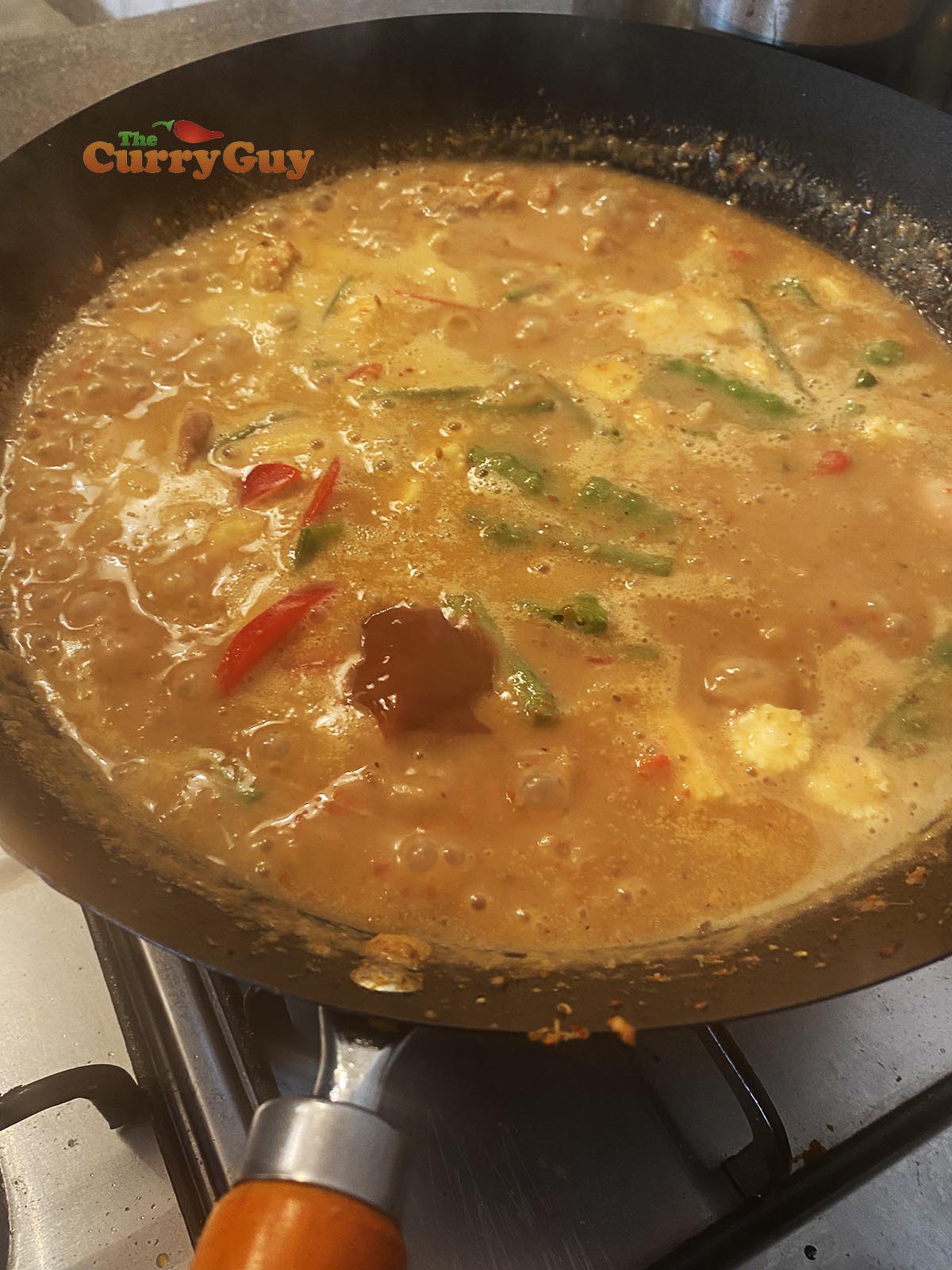 Finishing the curry with soy sauce and fish sauce.