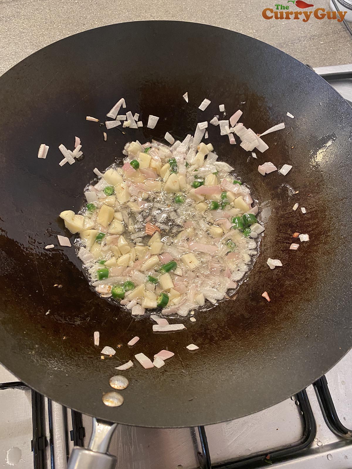 Frying veggies in wok. 