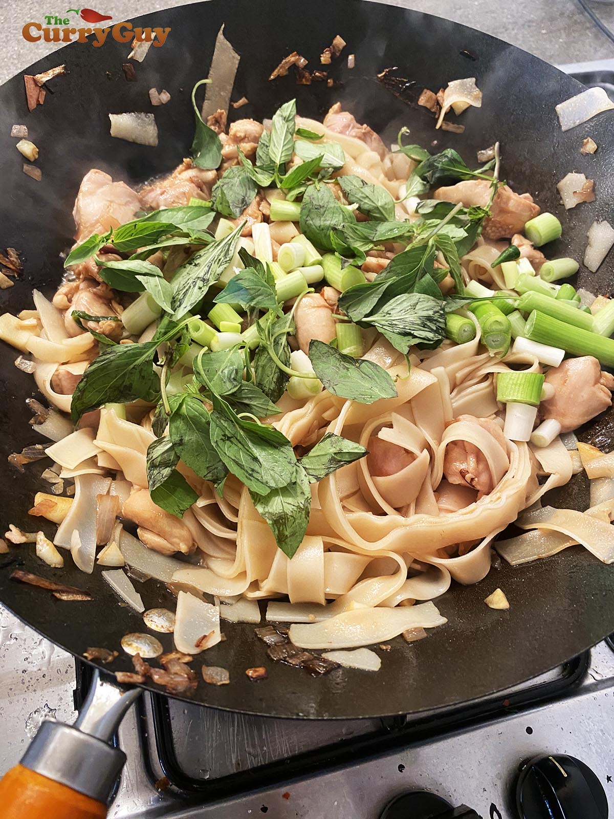 Adding noodles to pan