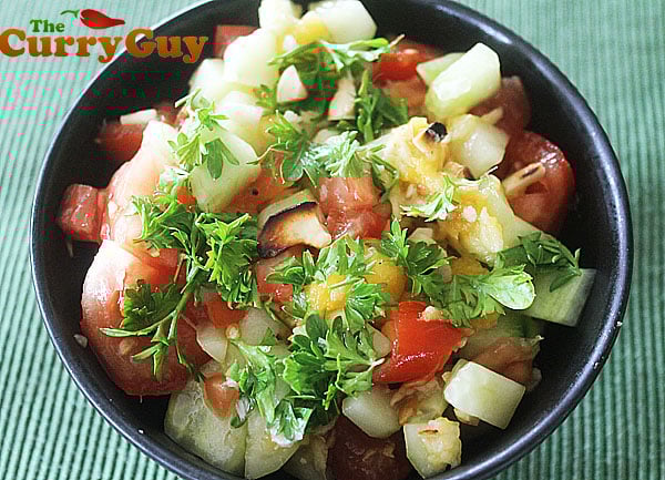 A Mango Salad With Tomato, Cucumber, Lime And Chillies
