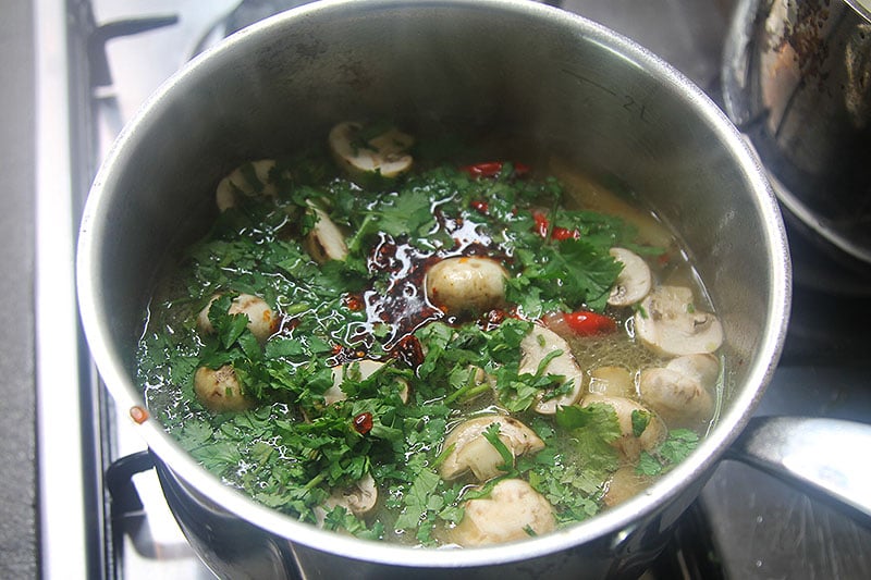 Finishing Thai spicy soup
