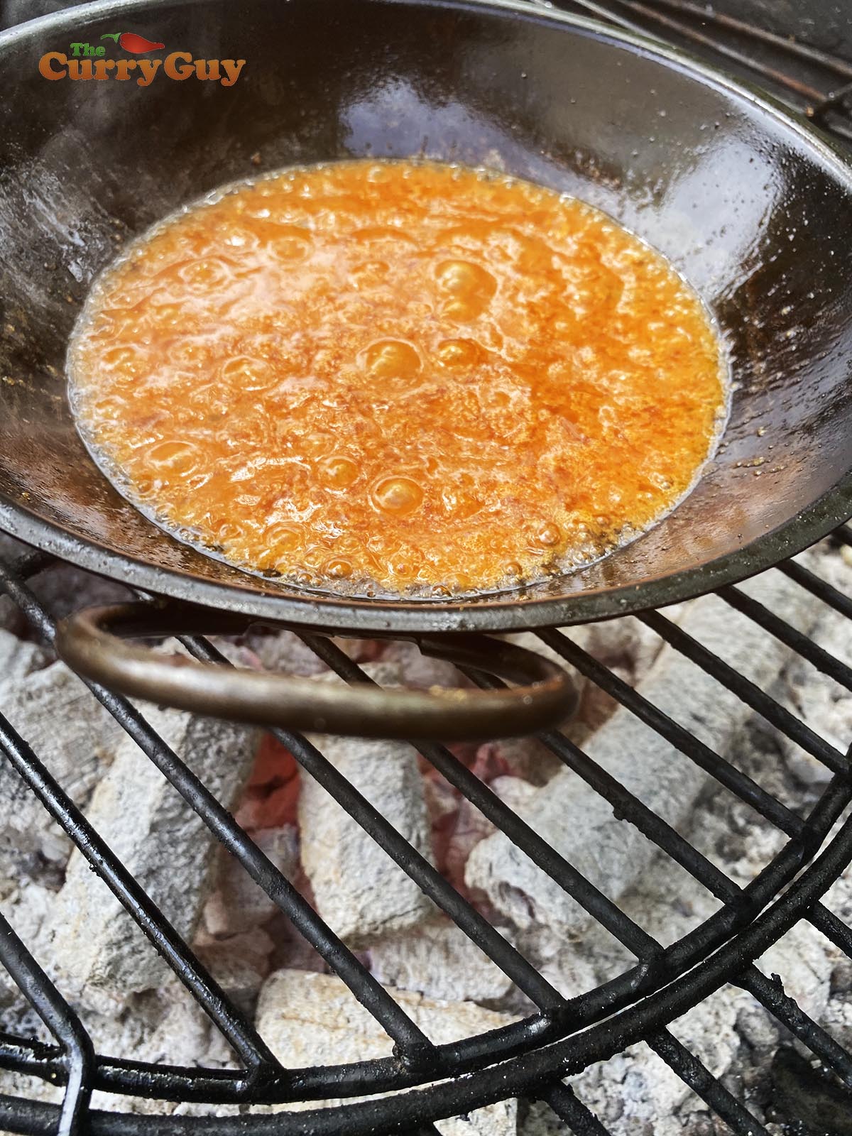 Adding base sauce to pan.