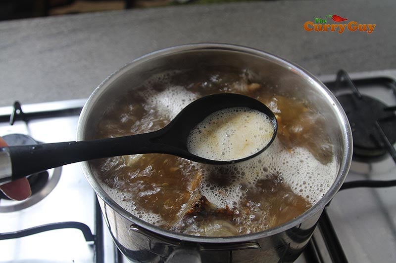 Foam rising from meat stock