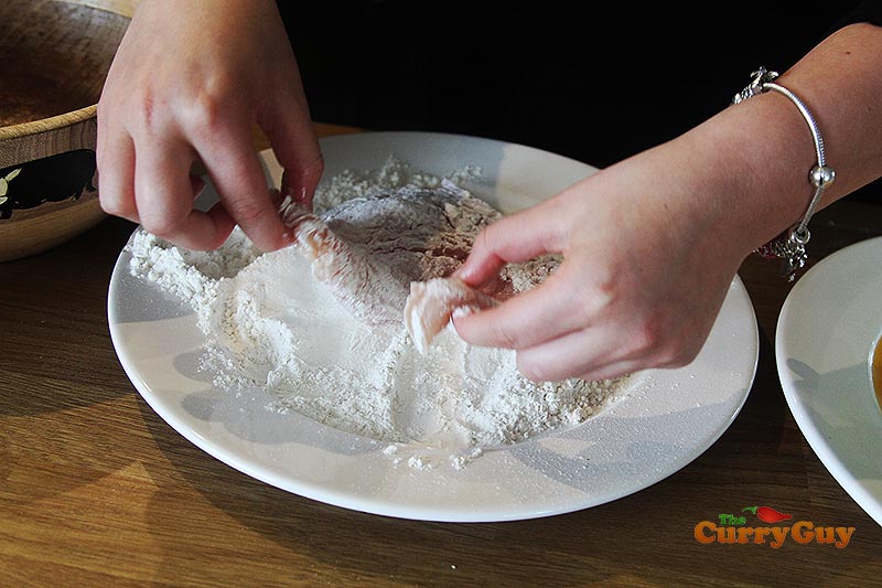 dredging chicken in flour