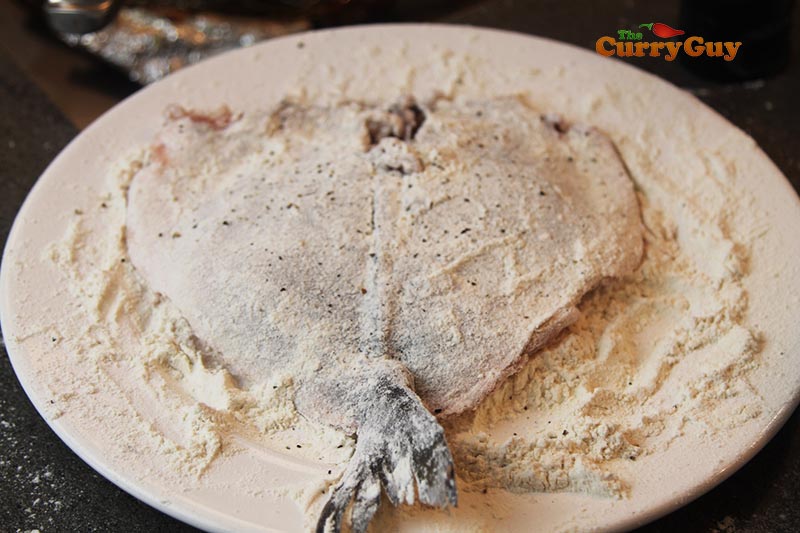 dusting the fish with flour