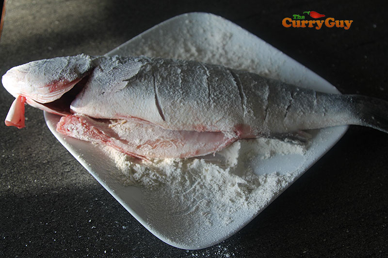 Dusting the fish with flour