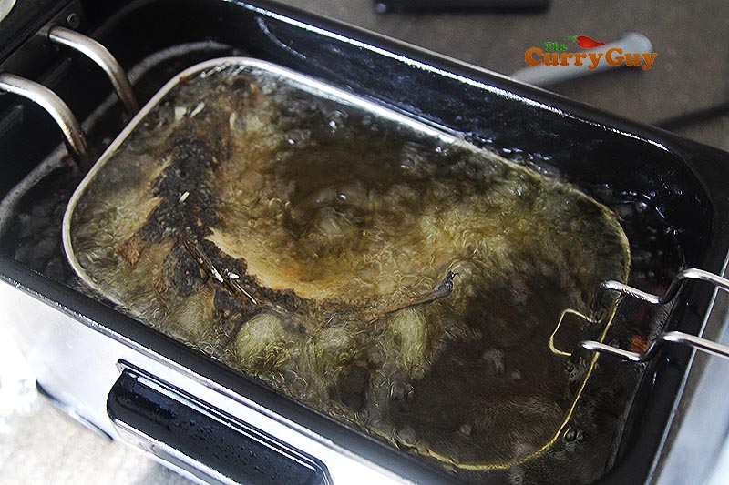 Deep frying the sea bass