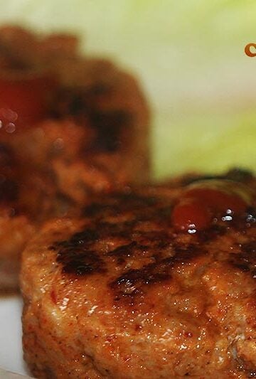 Adding hot sauce to sausages