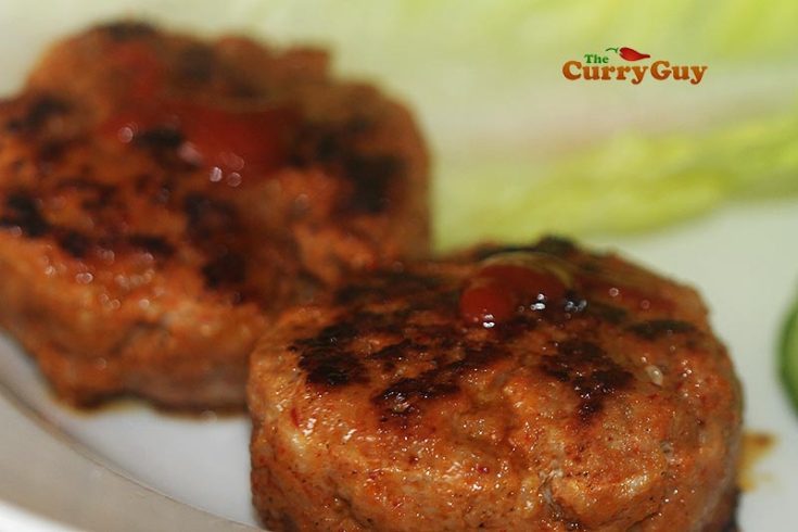 Adding hot sauce to sausages