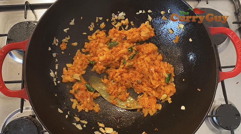 Stirring ingredients in sauce.