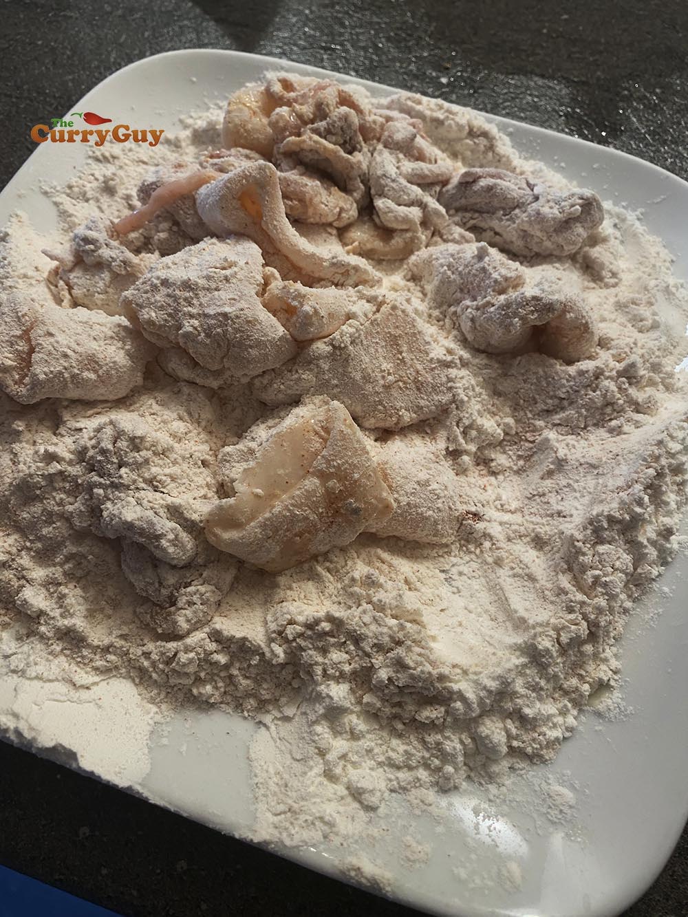 adding squid to flour mixture