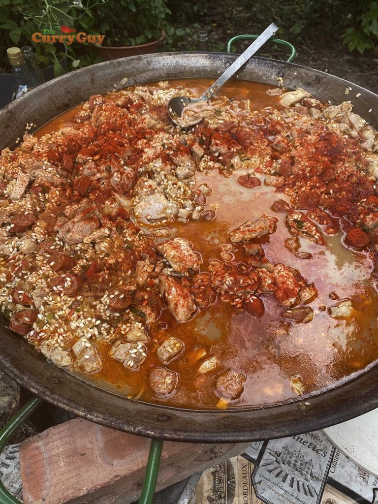 adding stock and paprika