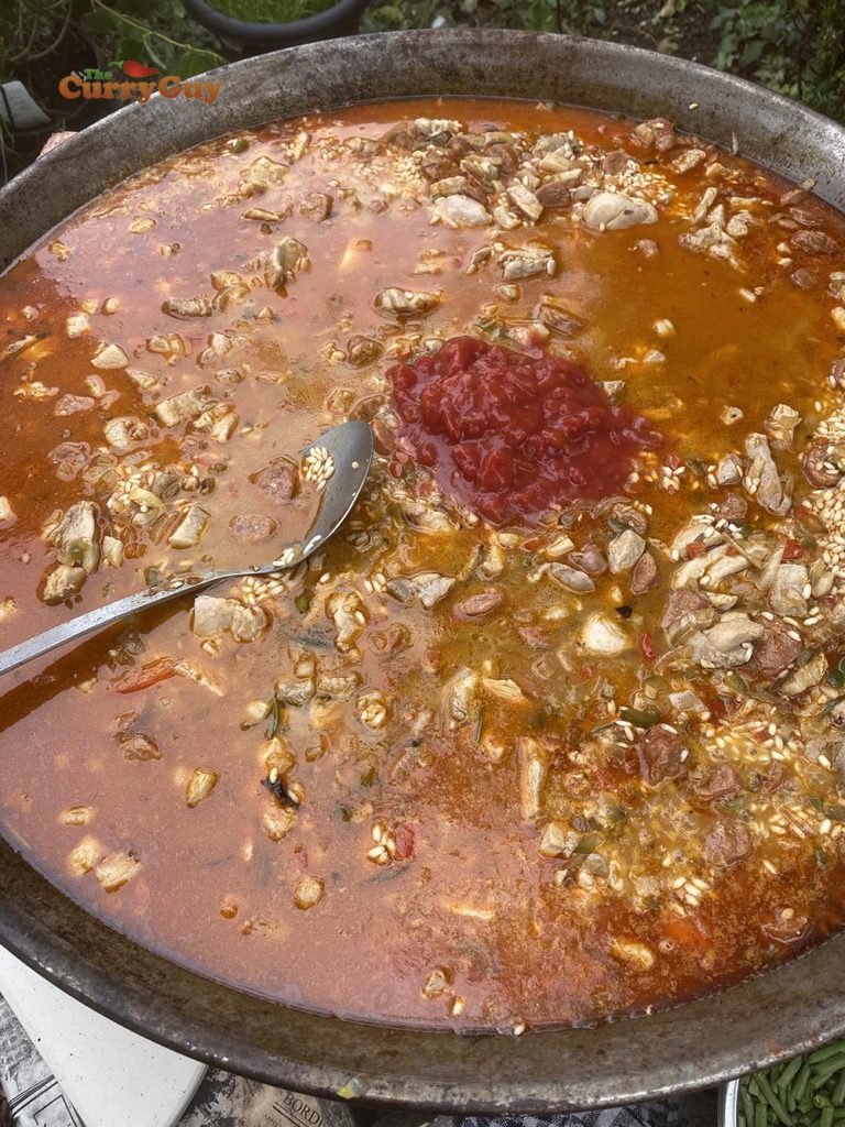 adding chopped tomatoes