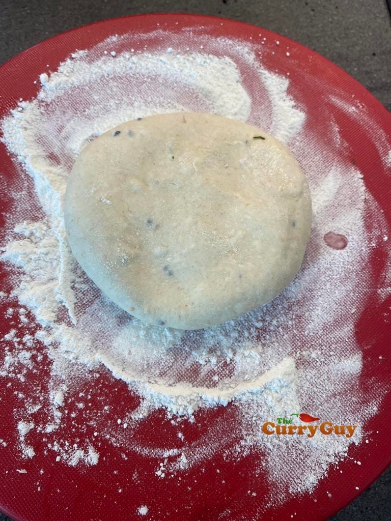Folding dough around the keema