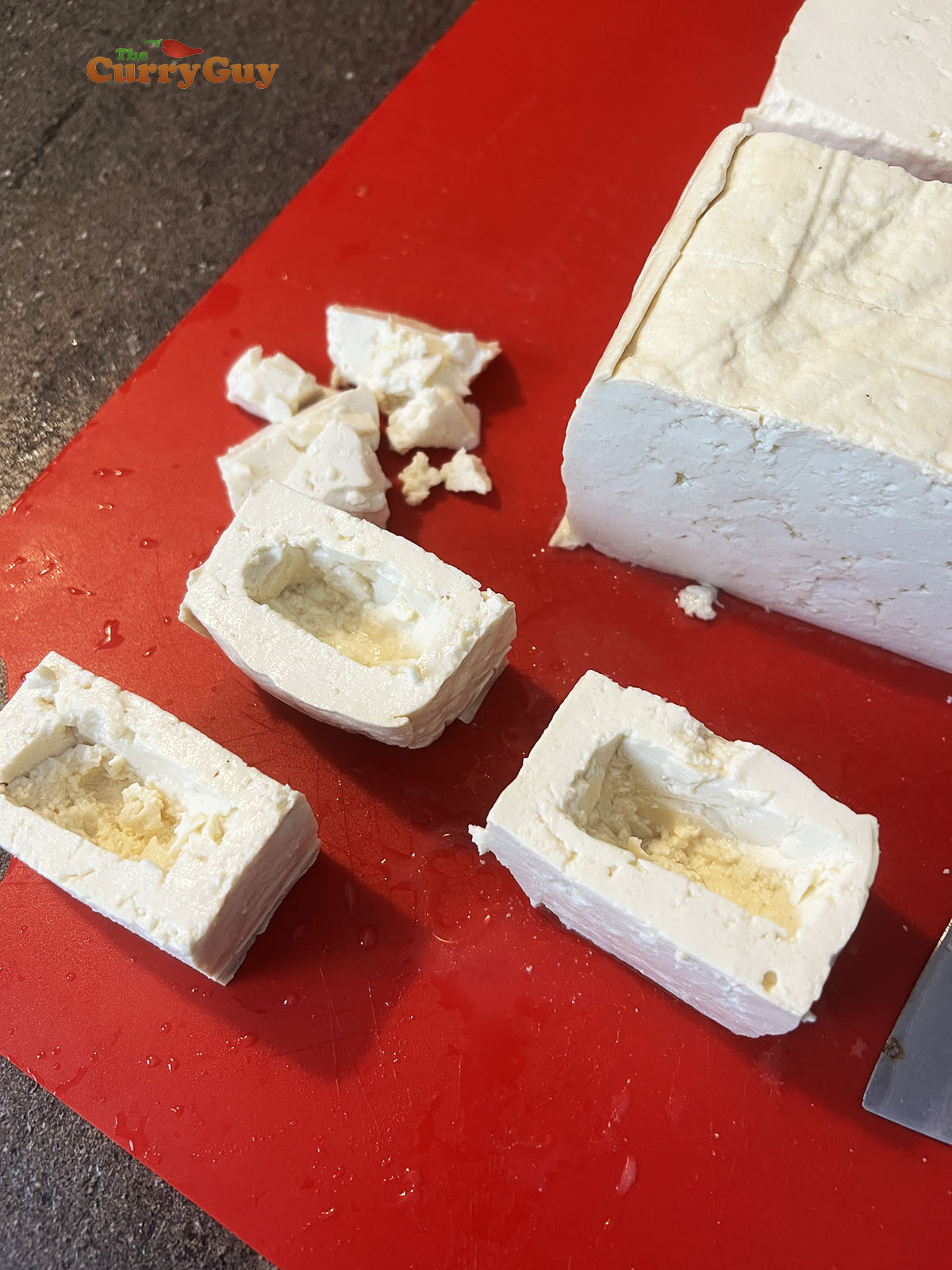 Preparing the tofu for stuffing.