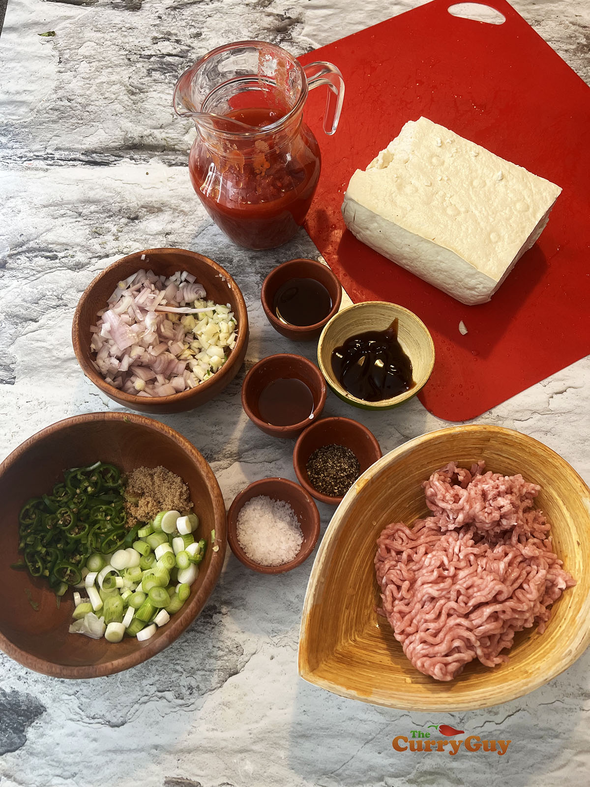 Ingredients for pork stuffed tofu in tomato sauce