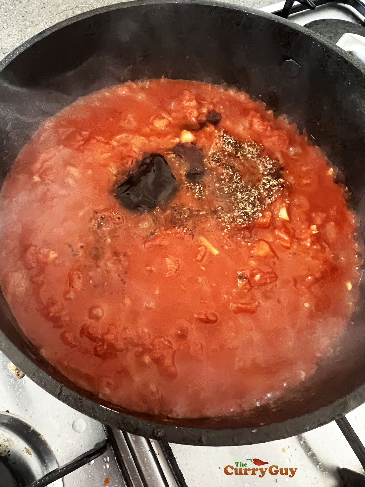 Simmering the tomato sauce.
