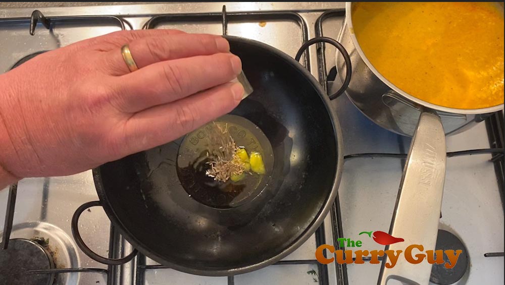 Melting ghee in a Balti Bowl