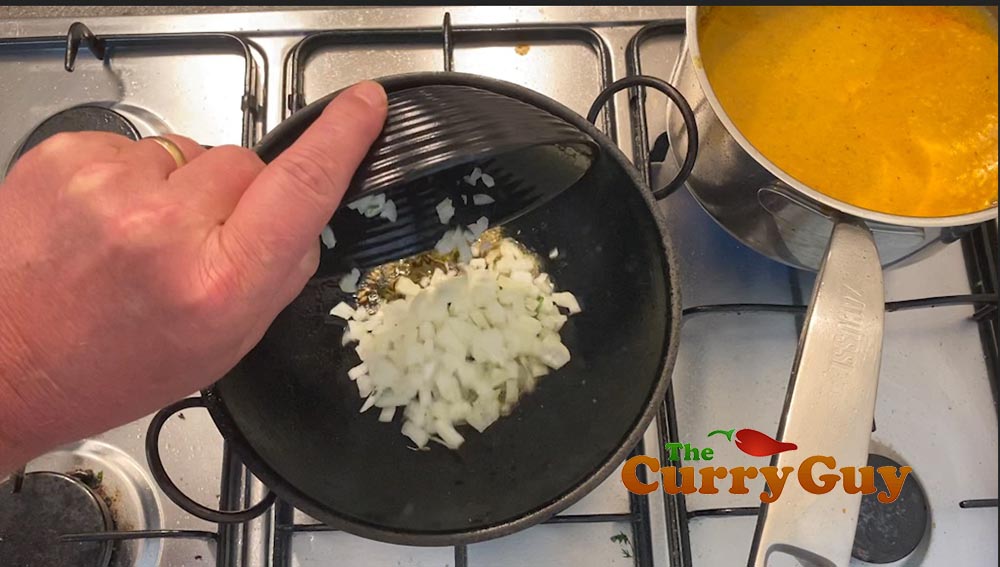 Adding onions to pan
