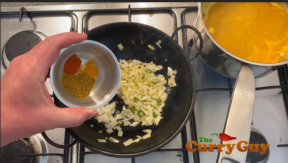 Adding the ground spices