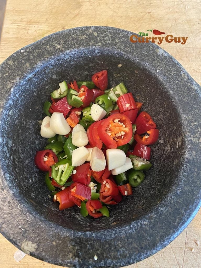 Chillies and garlic in a pestle and mortar