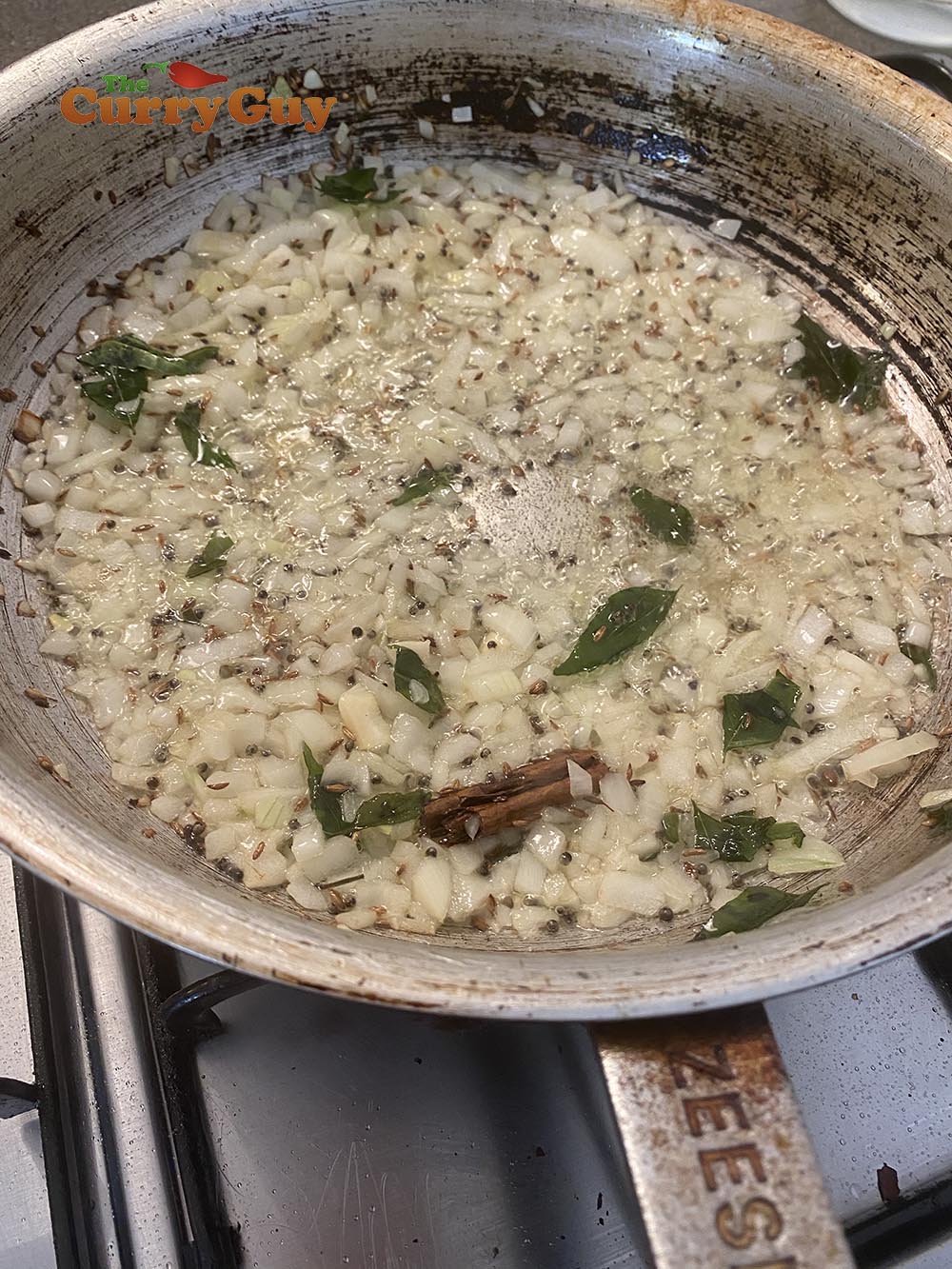 adding onion to the curry